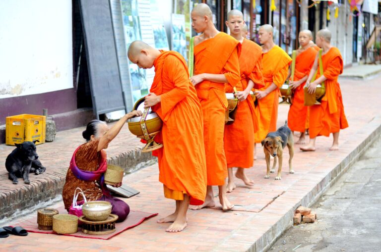 Monks collecting alms in Laos, a symbol of Lao culture