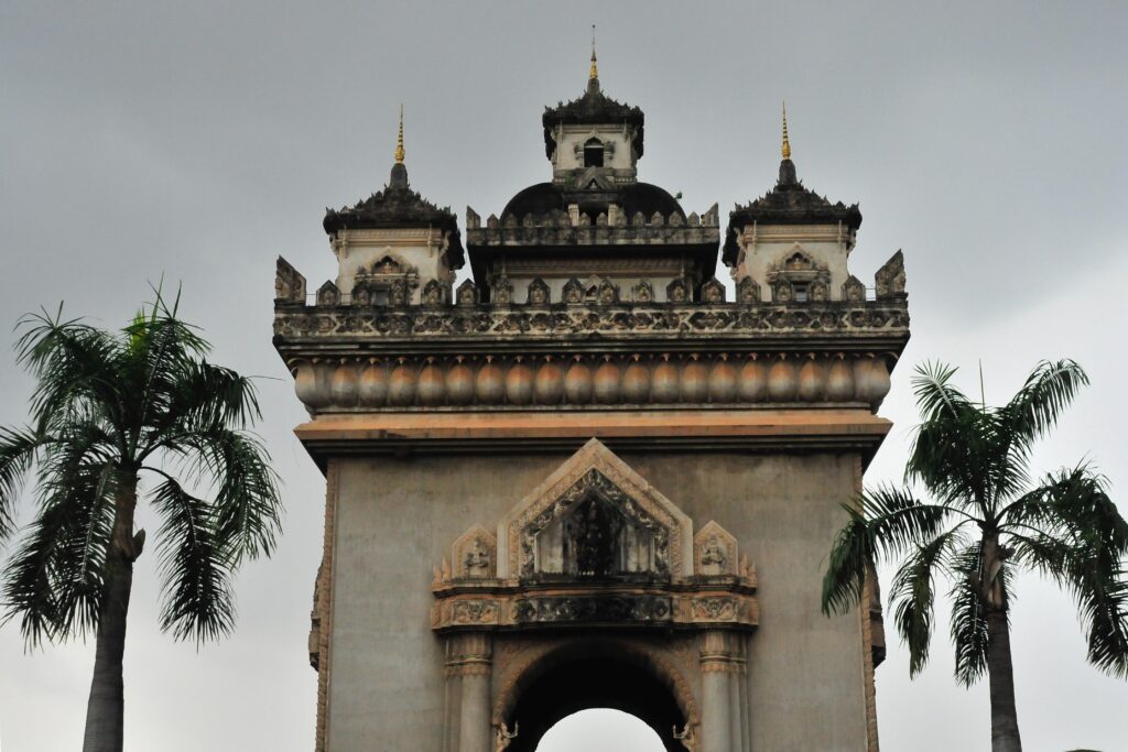 Patuxai, or Victory Gate, was erected in Vientiane with cement that was originally intended for another use. It is inspired by l'Arc de Triomphe in Paris.