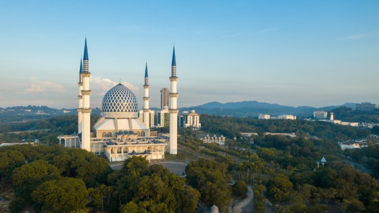 Aerial shot of Sultan Salahuddin Abdul Aziz Shah in Shah Alam, Selangor, Malaysia during sunrise. One of the biggest mosque in Malaysia and the landmark of Shah Alam, capital of the Selangor state.