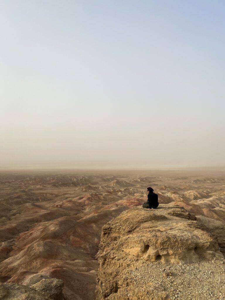 My friend sitting on top of a lookpoint in Tsagaan Svarga, Mongolia