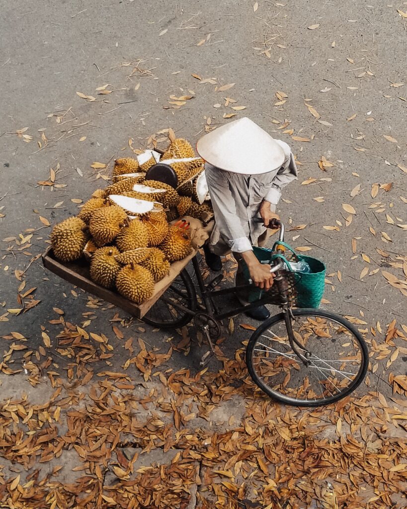 Man selling durian on the streets, Vietnam