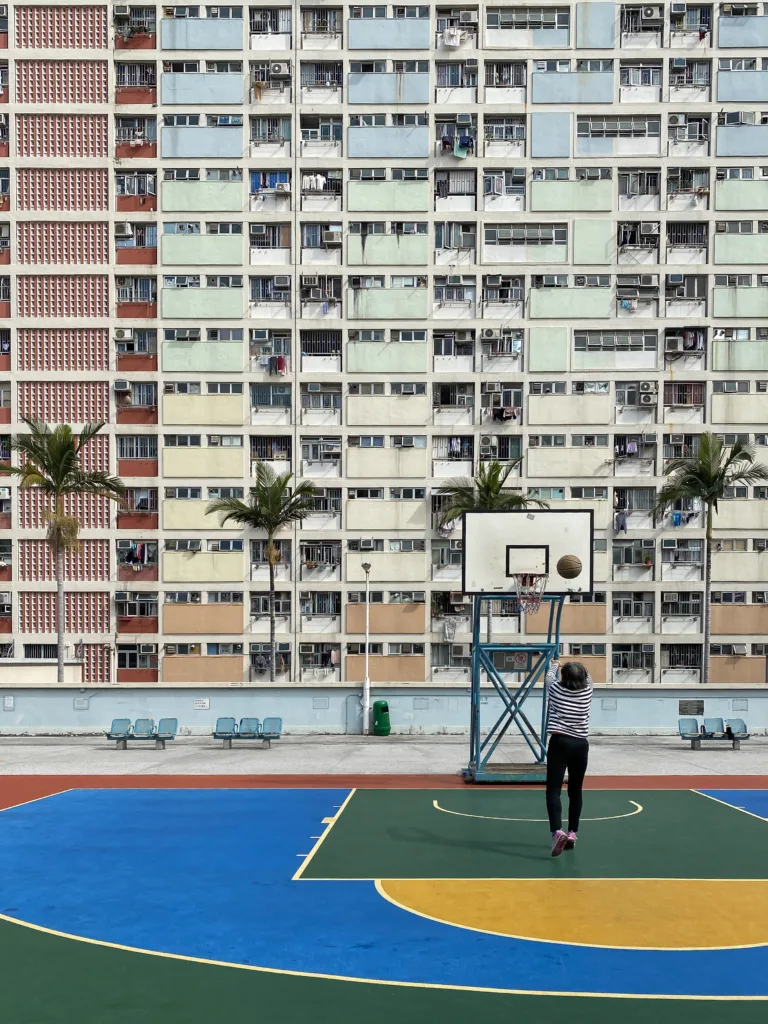 Resident playing basketball in Choi Hung Estate, Hong Kong
